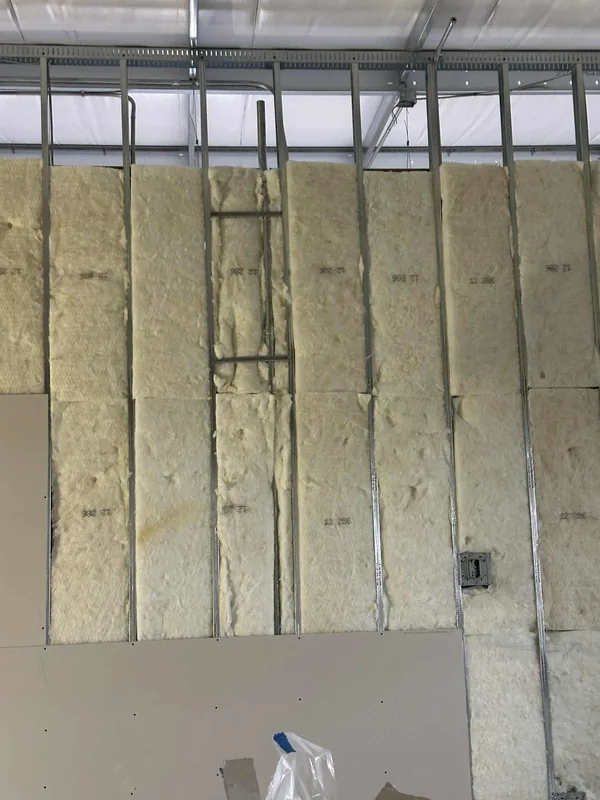Commercial wall insulation and partial drywall installation in Saskatoon