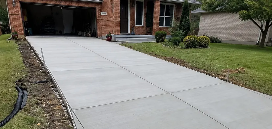 Completed broom-finish concrete driveway project in Saskatoon