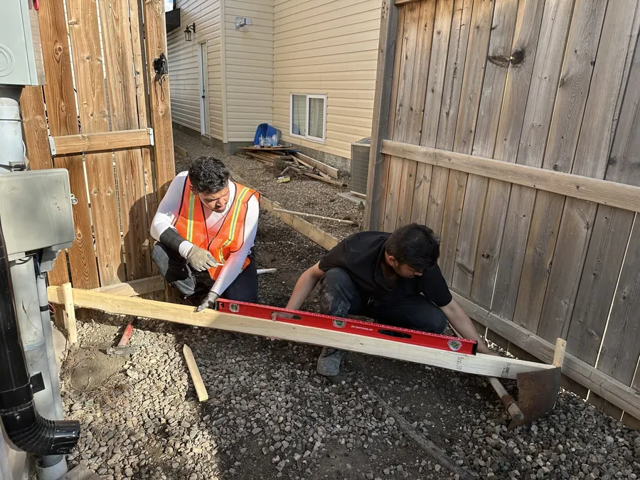 Workers installing concrete forms at a Saskatoon project