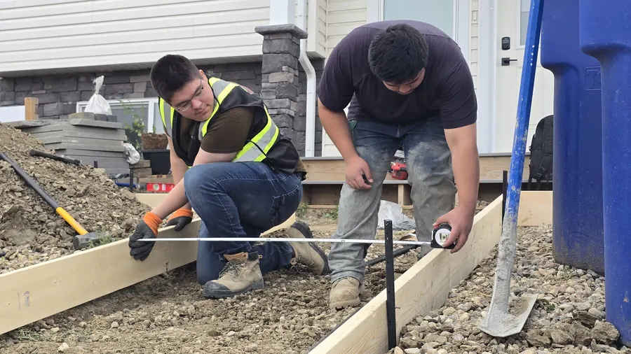 Crew checking residential concrete formwork and layout in Saskatoon