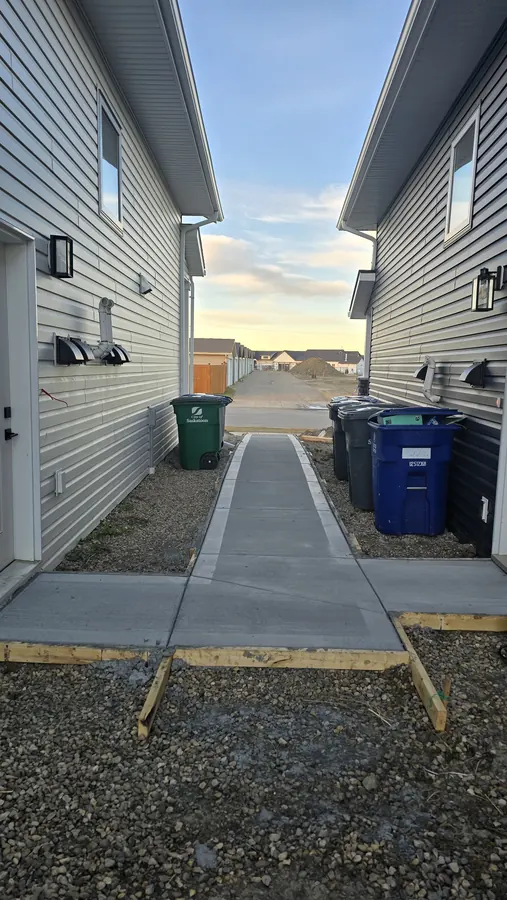 Completed concrete sidewalk and entrance work in Saskatoon