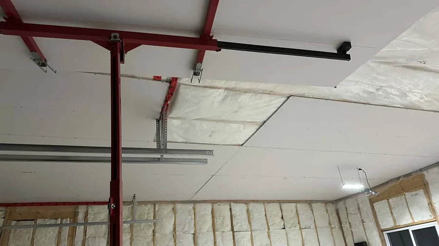 Garage ceiling drywall installation and insulation work in Saskatoon