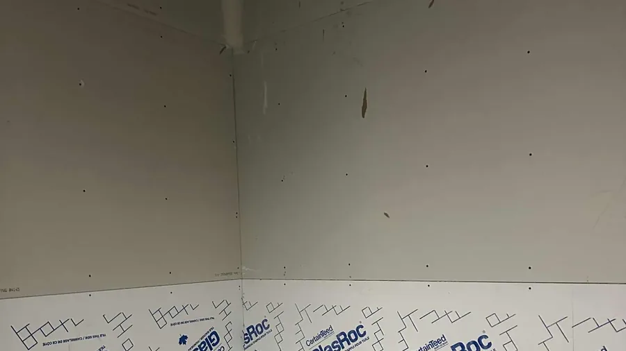 Landscape view of drywall board installation and wall preparation in Saskatoon