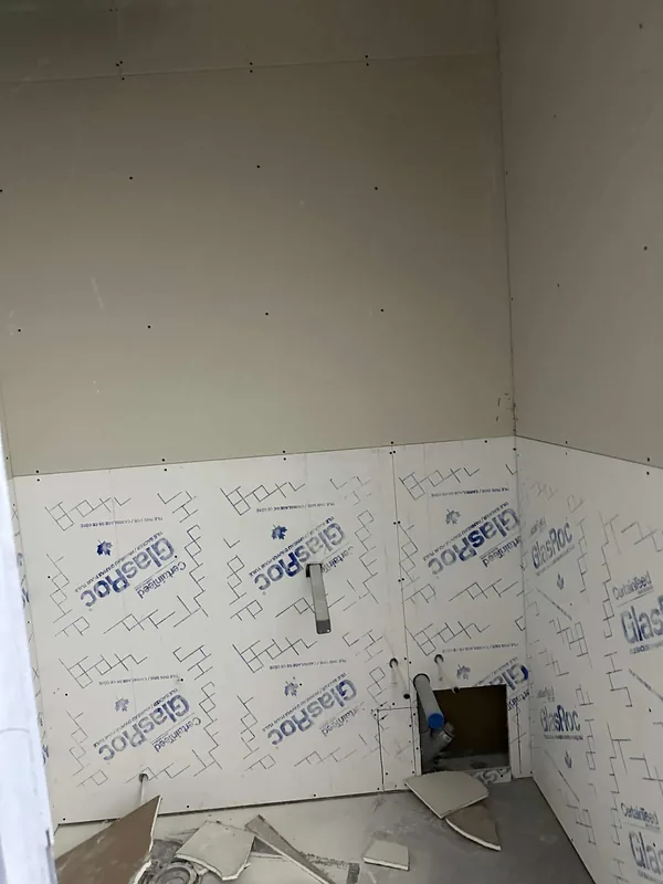 Drywall board installation and wall preparation in a small Saskatoon interior