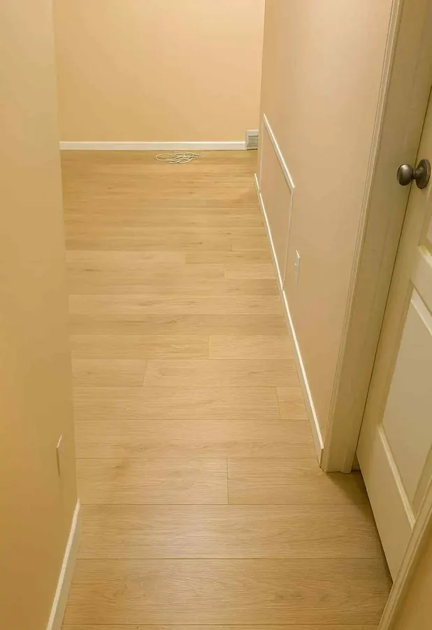 New flooring installed at a hallway and stair landing