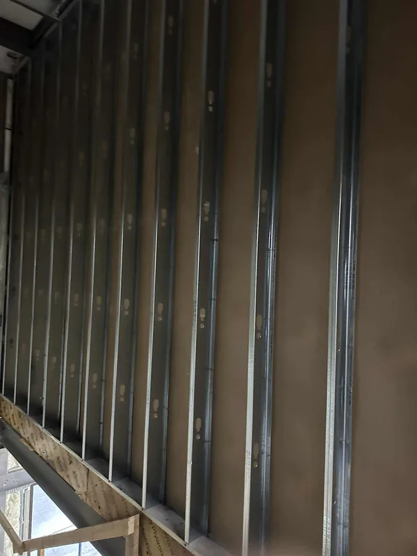 Interior metal stud framing prepared for drywall in Saskatoon